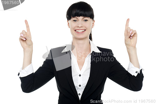 Image of Smiling woman posing with raised fingers