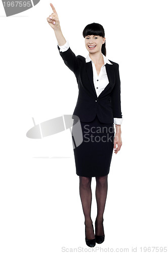 Image of Business lady pointing her finger upwards