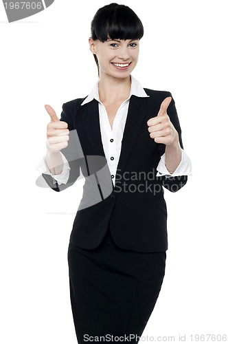 Image of Successful businesswoman gesturing thumbs up