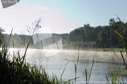 Image of morning fog on river and mysterious house 