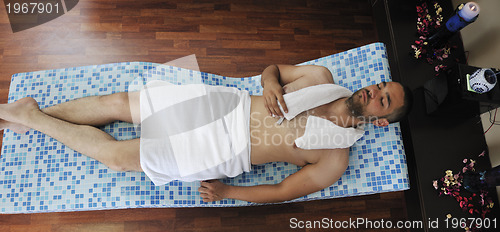 Image of man relaxing at spa