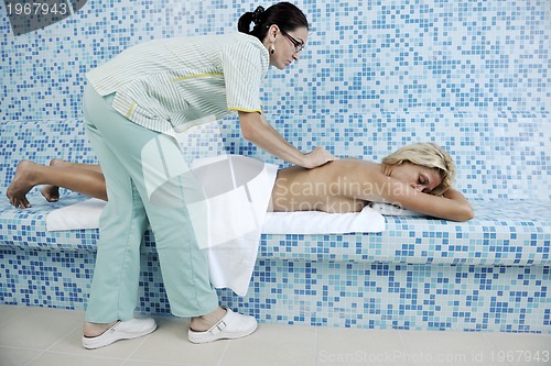 Image of woman relaxing at spa and wellness