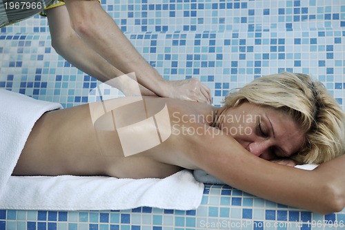 Image of woman relaxing at spa and wellness