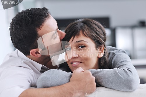 Image of happy young couple relax at home