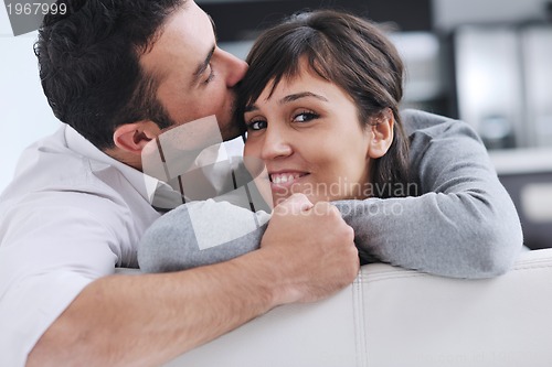 Image of happy young couple relax at home