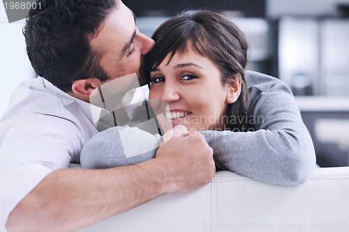 Image of happy young couple relax at home