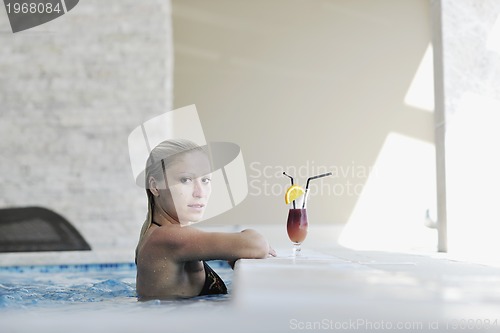 Image of woman relax on swimming pool