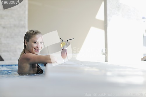 Image of woman relax on swimming pool