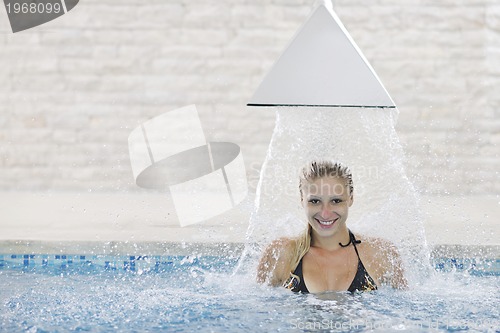 Image of woman relax on swimming pool