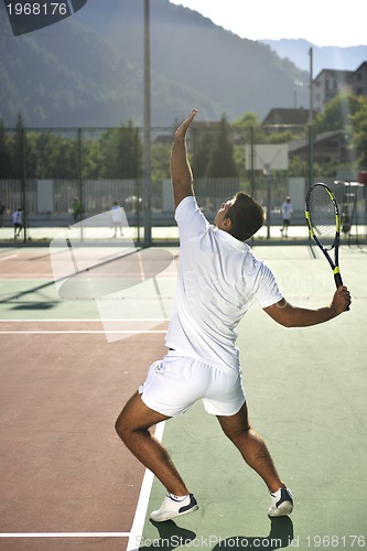 Image of young man play tennis