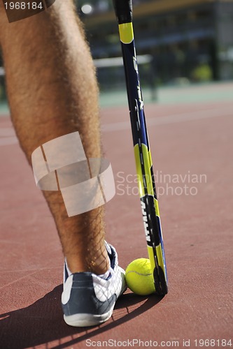 Image of young man play tennis