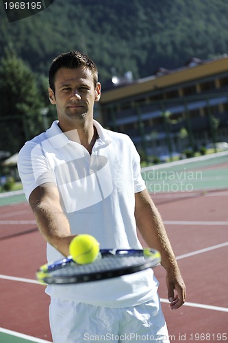 Image of young man play tennis