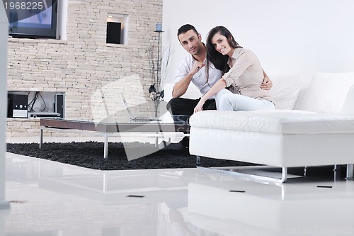 Image of happy young couple relax at home