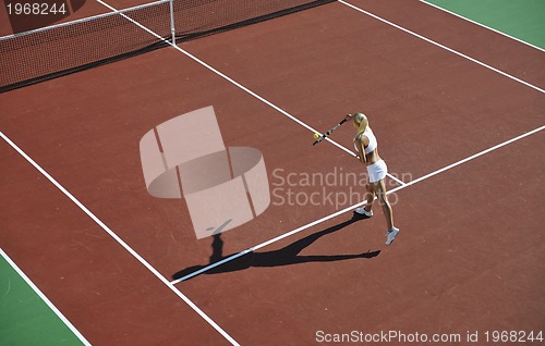 Image of young woman play tennis outdoor