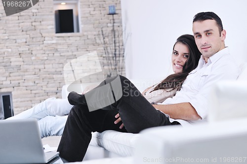 Image of happy young couple relax at home