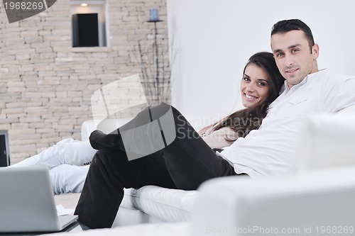 Image of happy young couple relax at home
