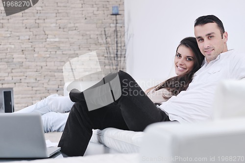 Image of happy young couple relax at home