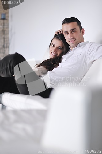 Image of happy young couple relax at home