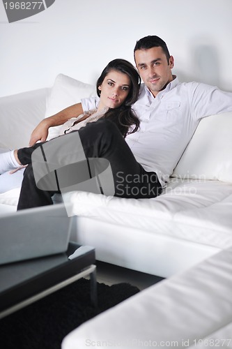 Image of happy young couple relax at home