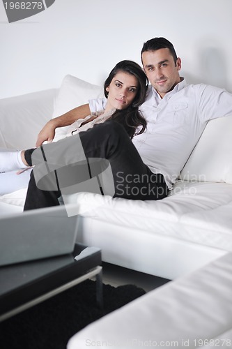 Image of happy young couple relax at home