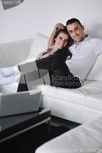 Image of happy young couple relax at home
