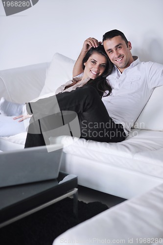 Image of happy young couple relax at home