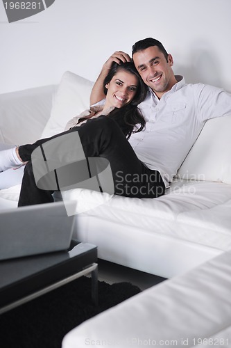 Image of happy young couple relax at home