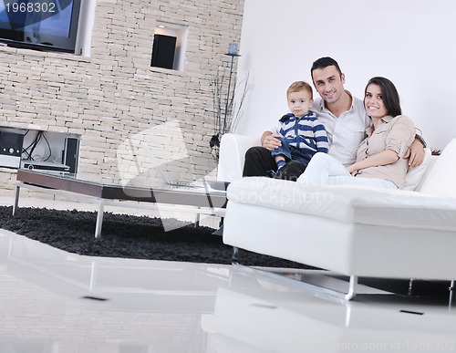 Image of happy young family have fun  with tv in backgrund