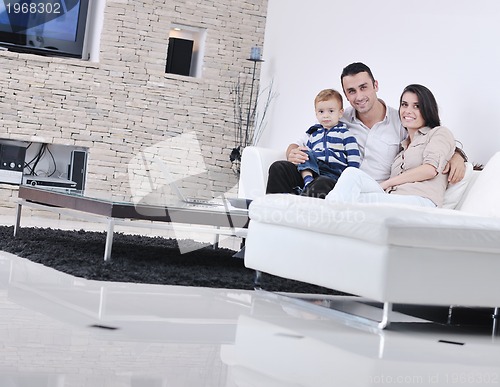 Image of happy young family have fun  with tv in backgrund