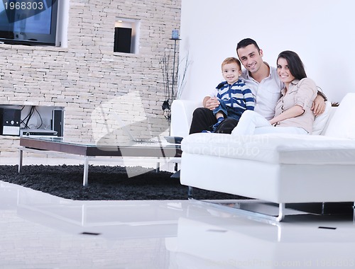 Image of happy young family have fun  with tv in backgrund