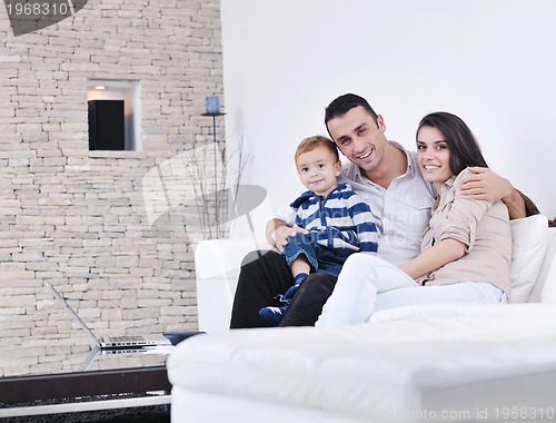 Image of happy young family have fun  with tv in backgrund