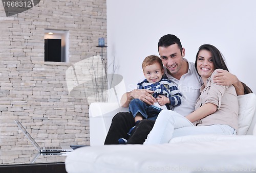 Image of happy young family have fun  with tv in backgrund