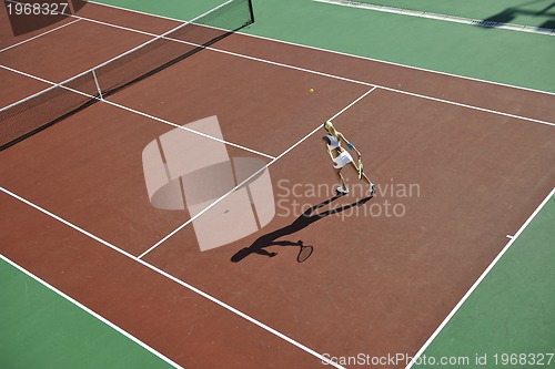 Image of young woman play tennis outdoor