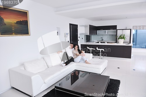 Image of happy young couple relax at home