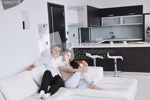 Image of happy young couple relax at home