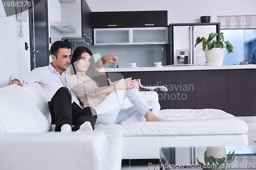 Image of happy young couple relax at home