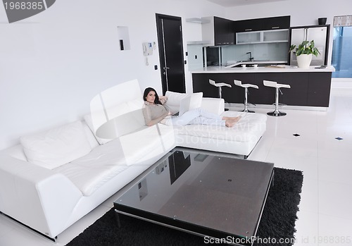 Image of woman work on laptop at home