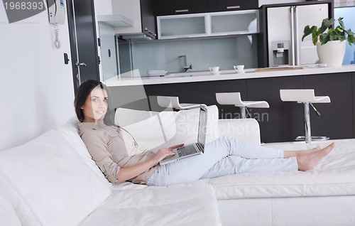 Image of woman work on laptop at home