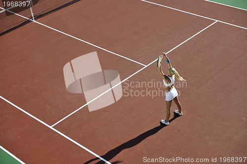 Image of young woman play tennis outdoor