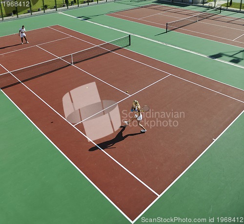 Image of happy young couple play tennis game outdoor