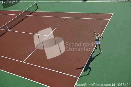 Image of young woman play tennis outdoor