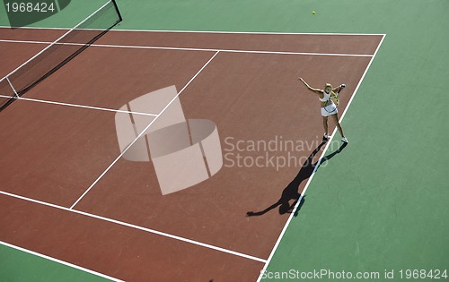 Image of young woman play tennis outdoor