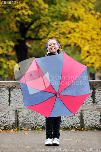 Image of happy girl with umbrella