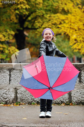 Image of happy girl with umbrella