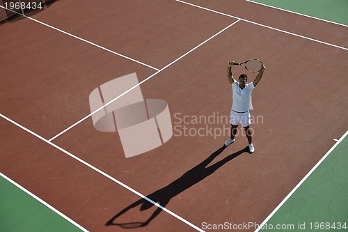 Image of young man play tennis