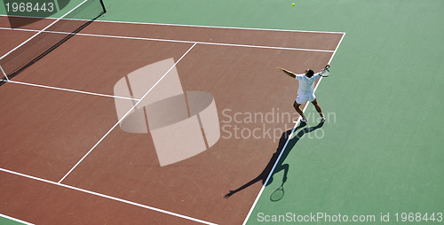 Image of young man play tennis