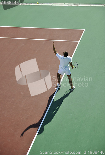 Image of young man play tennis