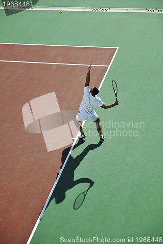 Image of young man play tennis