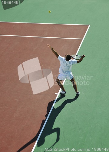 Image of young man play tennis