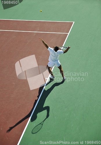 Image of young man play tennis